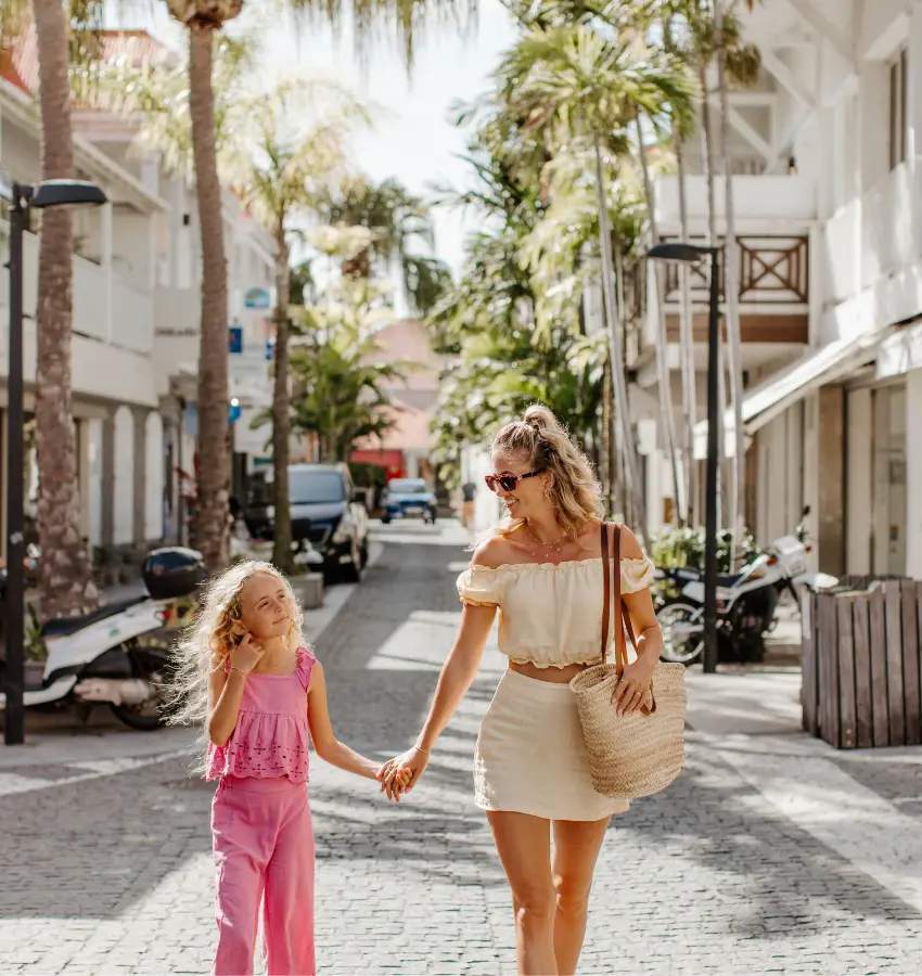 mom and daughter walking through downtown gustavia