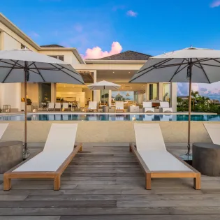 7.3 b.e. grace bay beachfront 5bd night view