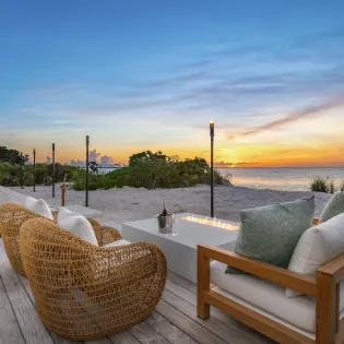 7.4 b.e. grace bay beachfront 5bd night view