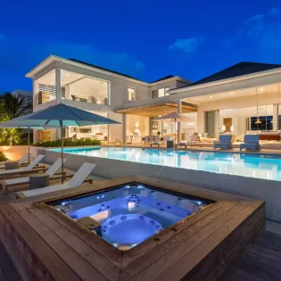 7.5 b.e. grace bay beachfront 5bd night view