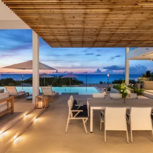 7.7 b.e. grace bay beachfront 5bd night view