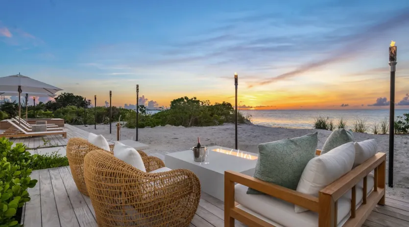 7.4 b.e. grace bay beachfront 5bd night view
