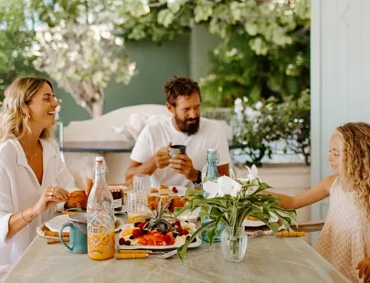 family of three eating chef breakfast