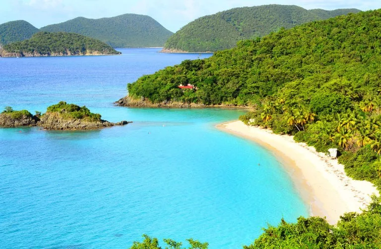 Trunk Bay on St. John has white sand beaches and turquoise waters. 
