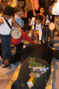 Children attempt to revive Vaval, the King of Carnaval