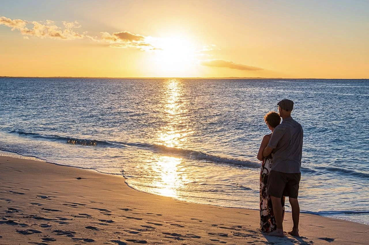 turks and-caicos, providenciales couple admire-sunset on leeward beach